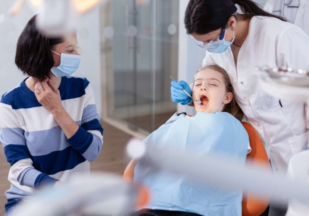 family visit at dentist office for dental check-up